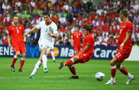 GENEVA - JUNE 11: Cristiano Ronaldo of Portugal scores his team's second goal during the UEFA EURO 2008 Group A match between Czech Republic and Portugal at Stade de Geneve on June 11, 2008 in Geneva, Switzerland. (Photo by Bryn Lennon/Getty Images)